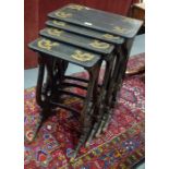 A 19th century gilt dragon decorated ebonised black lacquered nest of four occasional tables, raised