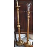 Two gilt painted wood standard lamps with spiral twist detail