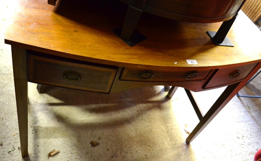 A Victorian style mahogany bowfront three drawer side table