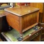 A Victorian mahogany box commode raised on turned legs