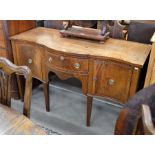 19th century mahogany serpentine form sideboard  with central drawer and flanking cupboards,