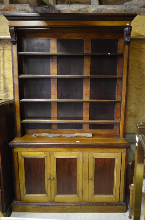 A Victorian stained pine and mahogany open library bookcase