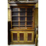 A Victorian stained pine and mahogany open library bookcase