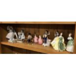 Three Lladro figures/models, five Royal Doulton figures, Royal Doulton Churchill character jug,