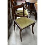 Set of six mahogany rope back dining chairs with green pad seats and sabre legs (four standard and