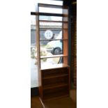Danish style teak tall bookcase with four open shelves over a pair of sliding glass doors