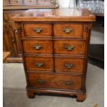 Georgian style walnut media cabinet with dummy drawer front, raised on bracket feet