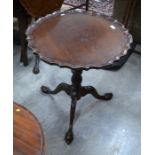 Mahogany scalloped tilt-top occasional table on turned and carved column and triform supports