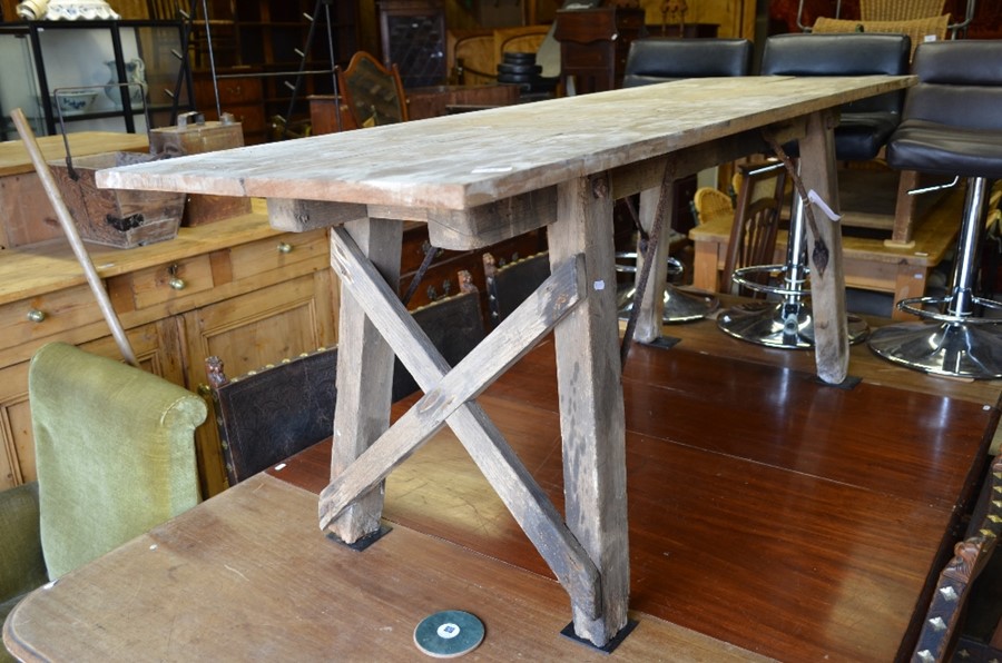 Vintage rustic pine and iron mounted trestle table