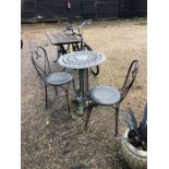 A Victorian style cast iron garden/terrace table to/with a pair of chairs (3)