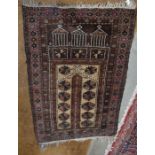 Hatchi Balouch prayer rug, brown ground with triple mihrab design within multi borders 125x80cm