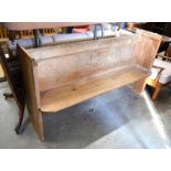 An old waxed pine pew