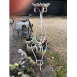 A weathered Victorian style wrought iron jardiniere
