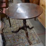 19th century oak circular tilt top table on turned column and tri form supports