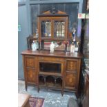 A late 19th century Sheraton Revival rosewood and inlaid mirror-backed cabinet, the upper part