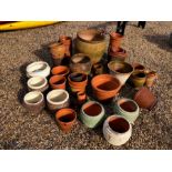 A large quantity of assorted terracotta tubs, pots etc. and other pots
