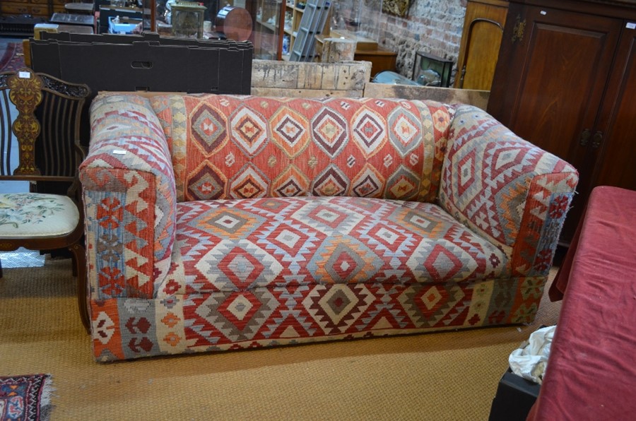 A two seater chesterfield style sofa with geometric design kelim upholstery 192cm wide x 93cm deep x