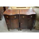 Pair of mahogany serpentine front bedside cabinets each with a single drawer over cupboard door