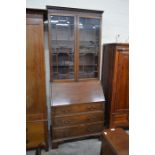 A 19th century mahogany bureau bookcase with astragal glazed doors and fall front panel enclosing