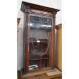 Mahogany wall display cabinet with carved swags and glazed door enclosing three shelves