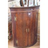 19th century oak barrel front hanging corner cupboard with two doors