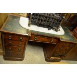 Victorian walnut inverted breakfront knee hole desk with green leather top over nine drawers