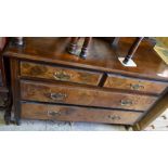 A mahogany and walnut chest of two short ober two long drawers