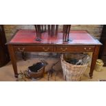 A mahogany library table with gilt tooled red leather top over two frieze drawers raised on square