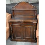 Victorian walnut serpentine front chiffonier with frieze drawer over a pair of panelled cupboard