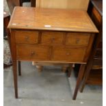 Small mahogany inlaid desk with five drawers, tapering square supports (a/f)