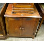 A mahogany media cabinet with a pair of panelled cupboard doors