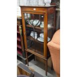 A Sheraton style inlaid display cabinet with single glazed door enclosing two shelves