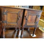 Pair of old charm oak bedside cabinets each with a panelled cupboard door raised on turned supports