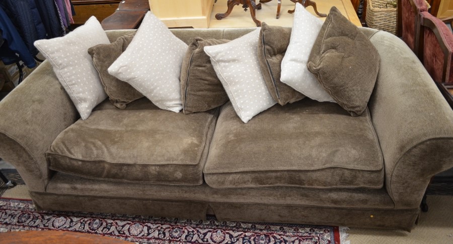 An oversized good quality chesterfield style sofa with patterned brown upholstery on turned feet c/w