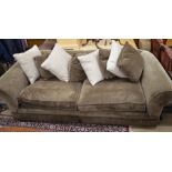 An oversized good quality chesterfield style sofa with patterned brown upholstery on turned feet c/w