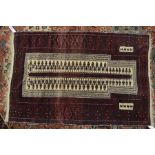A Persian-Kurdish prayer rug, the two rows of guls on red-brown ground, circa 1940, 1.40 x .90 m [