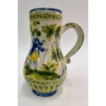 A late 19th century continental tin glazed jug decorated with an old woman and man in a rural