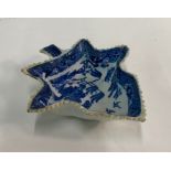 An early 19th century pearlware blue transfer printed willow pattern pickle dish, 13.2 cm longChip