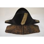 A 19th century naval bicorn hat with metallised braid and tassel embellishment, to/w a japanned