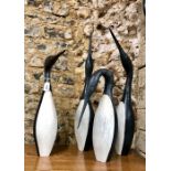 Guy Taplin (b.1939) - A set of four'Guillemots', painted driftwood (reputed skittles found as