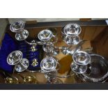 A pair of silver on copper candelabra and other electroplated wares, including bottle coaster,