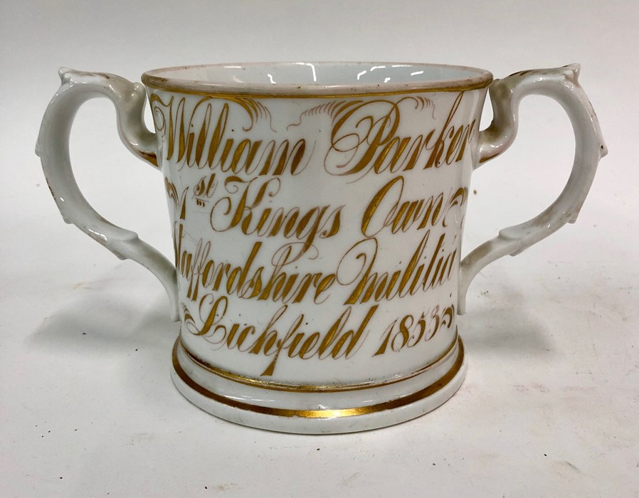 Of Military Interest - A Victorian Staffordshire loving cup,  painted polychrome flowers to one side - Image 2 of 2