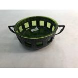 An Art Nouveau English pewter bowl with green glass liner, embossed with stylised foliate, 17.5 cm