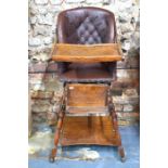 An antique metamorphic brown leather button child's high chair on an oak frame