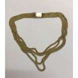 A four row rope link necklace on square snap, unmarked and untested yellow metal, approx 38.6g all