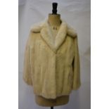 An ivory white mink jacket retailed by Alma Furs, Wimbledon, 61 cm across chestGood worn conditiion.