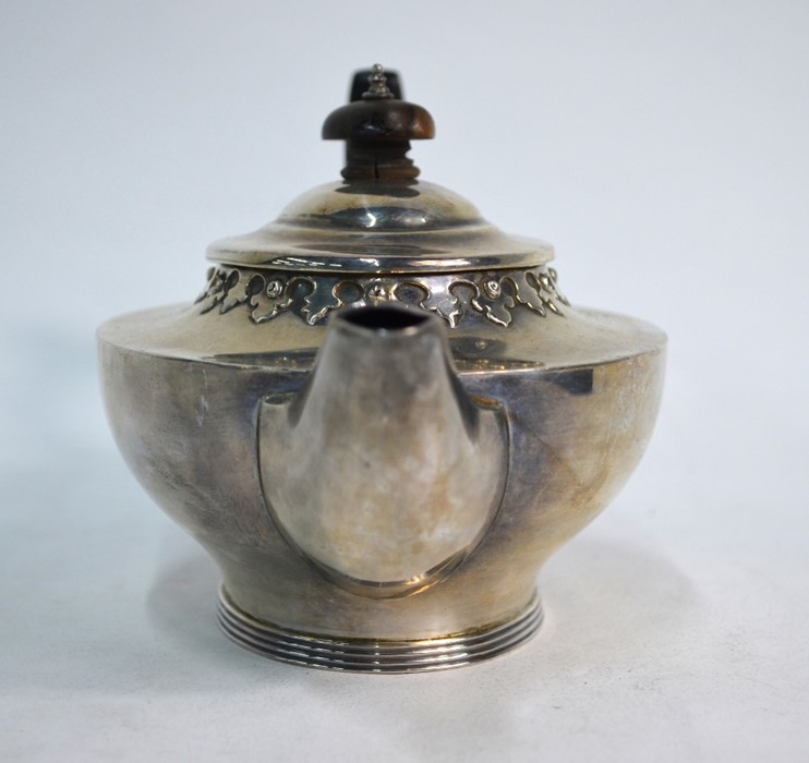 An oval silver bachelor teapot with Gothic-style embossed rim and reeded foot, Charles Edwards, - Image 3 of 3