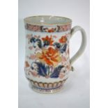 A Chinese Imari tankard, decorated in typical colours with bold designs of flowering peony, 14 cm