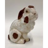 A pottery white and brown glazed model of a seated rabbit, 19 cm highGood condition - no chips or