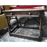 A 17th/18th century oak side table, the three plank top over a single frieze drawer with applied